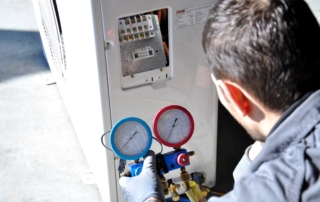 repairman investigation air conditioner troubles