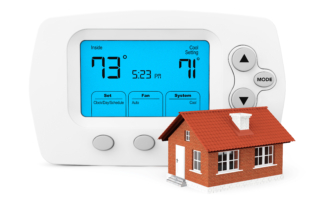 Modern Programming Thermostat with small home on a white background
