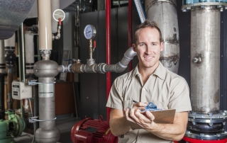 Technician inspecting St George heating