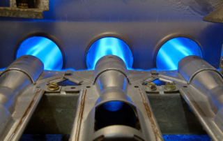 A furnace that clicks then lights the gas burners